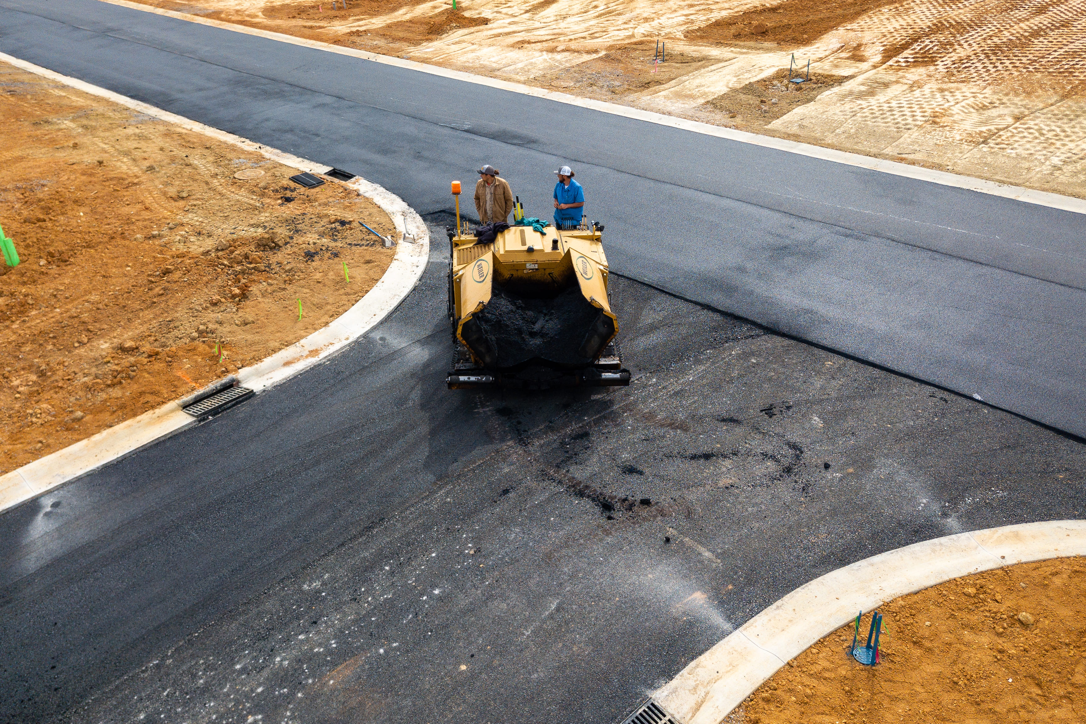 Professional commercial paving equipment in action